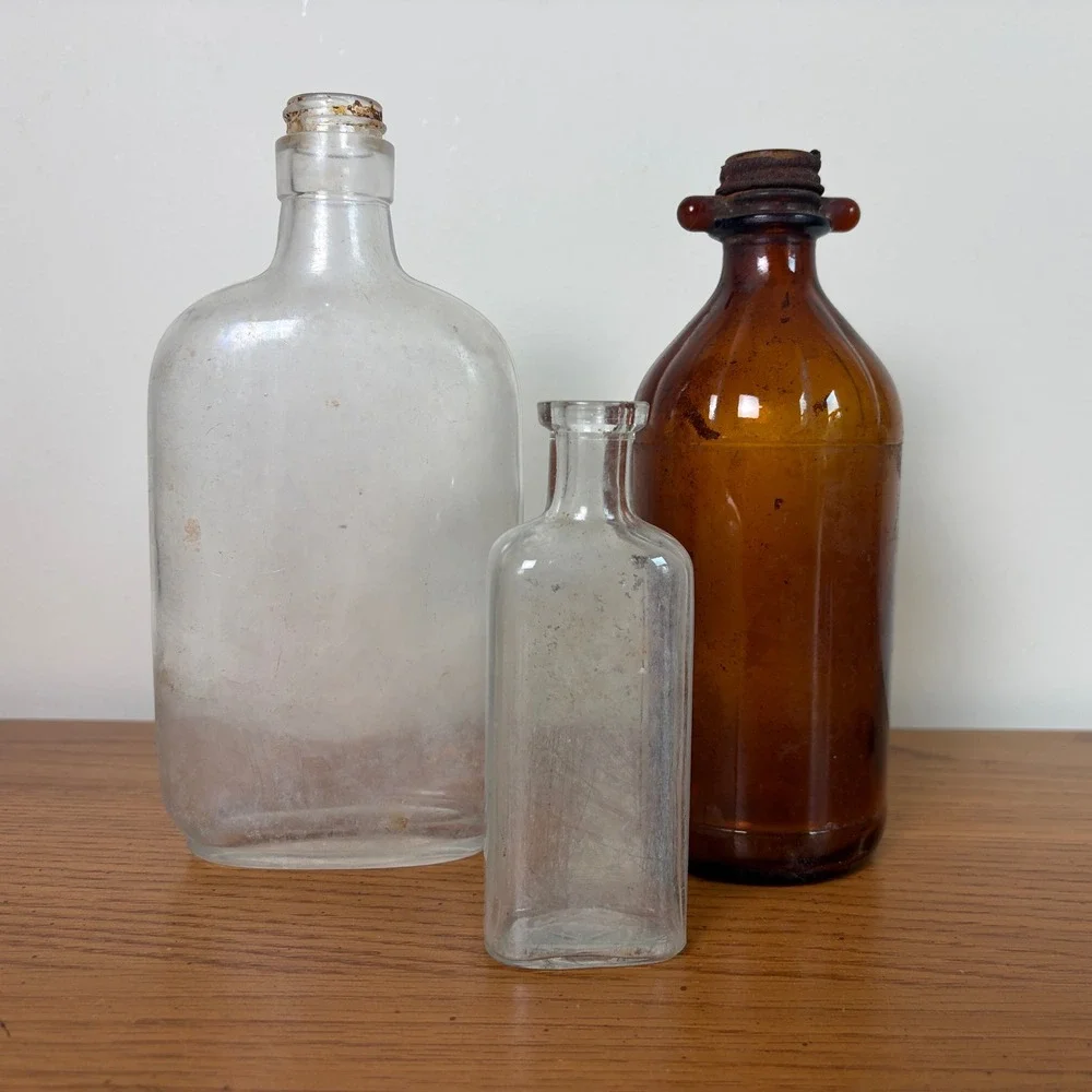 Vintage Glass Bottle Trio Amber and Clear Apothecary Medicine Bottles Set of 3